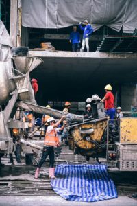 Men Pouring Concrete Compliments of My Foundation Repair Houston Source